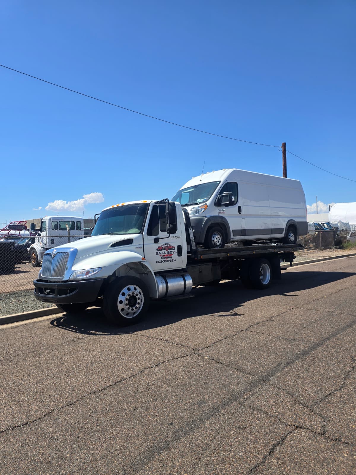 Baja Boys Towing flatbed truck providing roadside assistance in Phoenix
